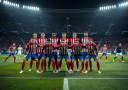 Atlético Madrid players in their famous defensive shape during a tense La Liga encounter